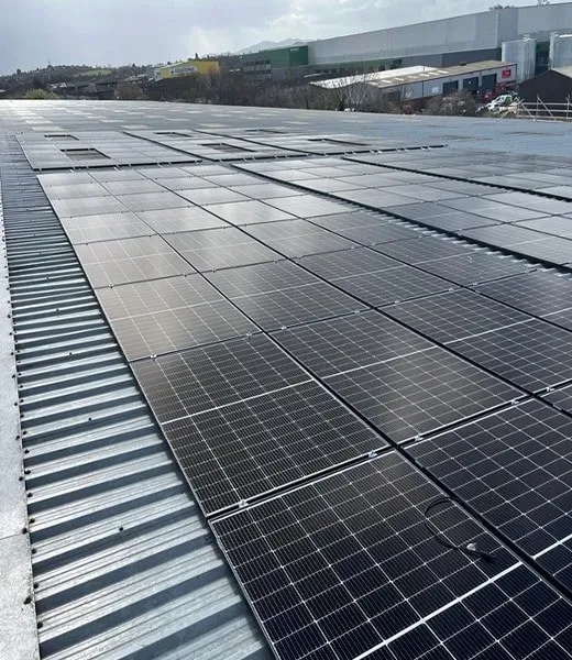 Solar panels on a Henry Colbeck warehouse roof, the partnership that took GTP to Glasgow