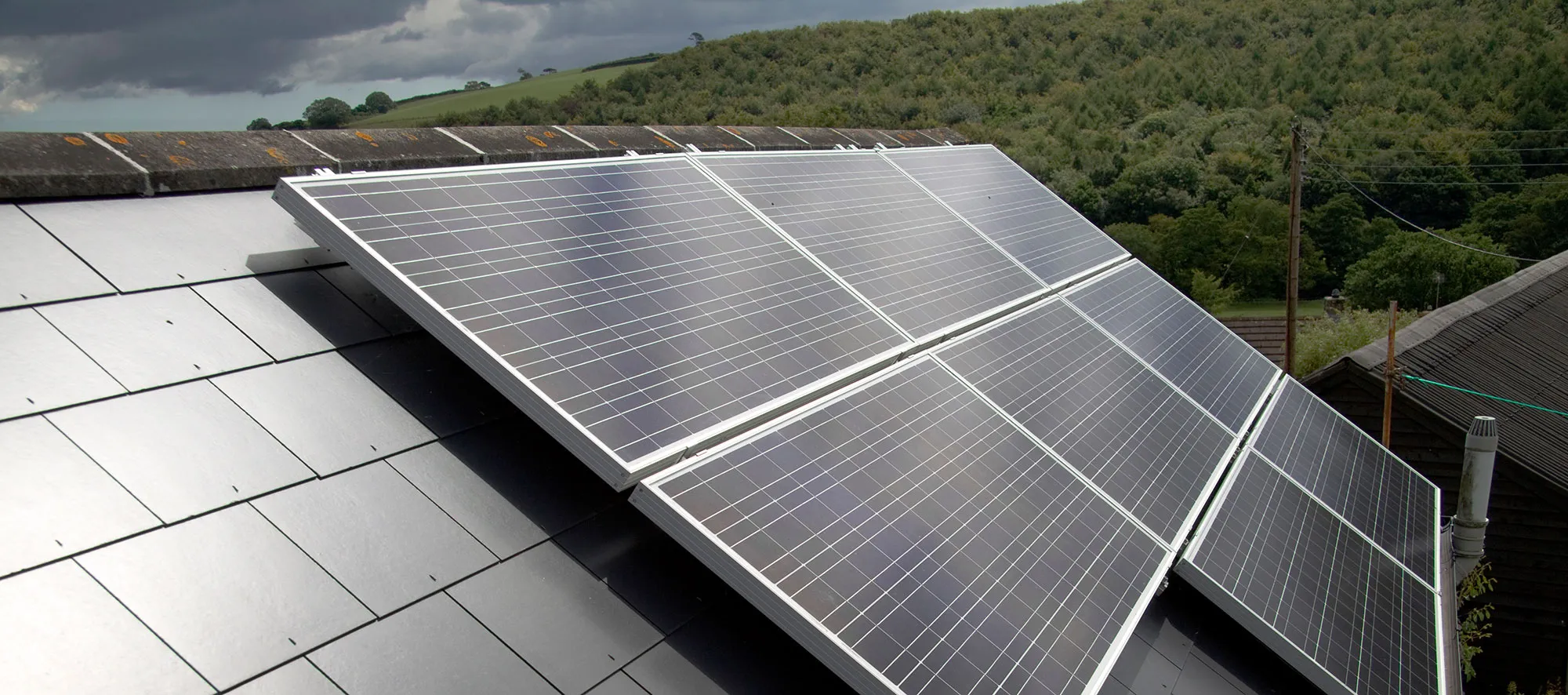 Solar panels installed on the pitched roof of a house in the North East countryside