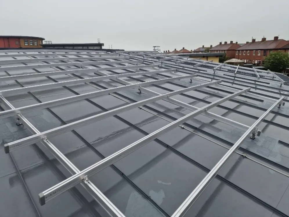 Mounting rails following the curve of the school roof