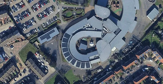 Bespoke fixings on the curved TPO membrane roof at Horsley Hill Campus
